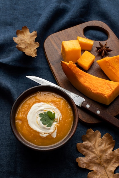 Slices of pumpkin on wooden board high view