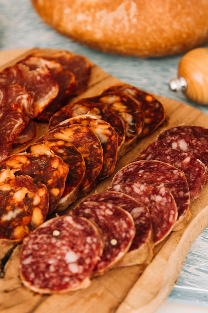 Slices of sausages near bread