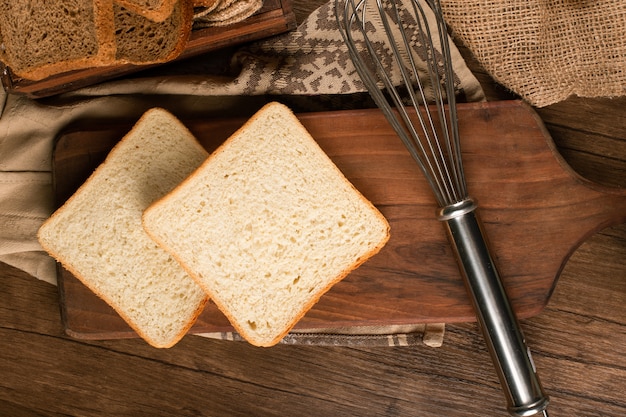 Slices of white bread on kitchen board