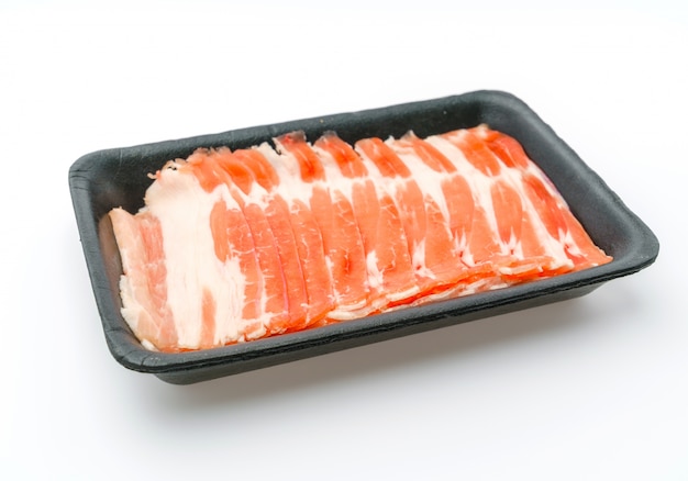 Slide of  raw pork  on white background .