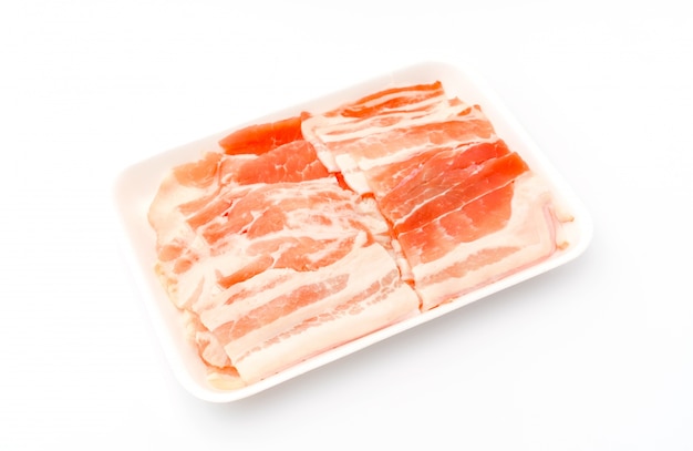 Slide of  raw pork  on white background .