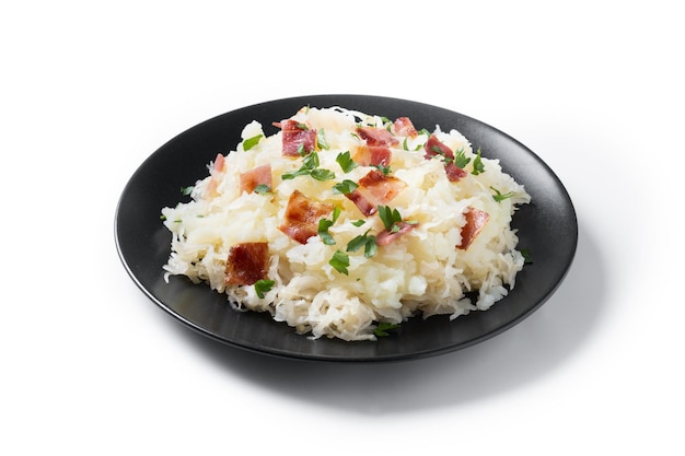 Free photo slovak potato dumplings halusky with steamed sauerkraut and bacon isolated on white background