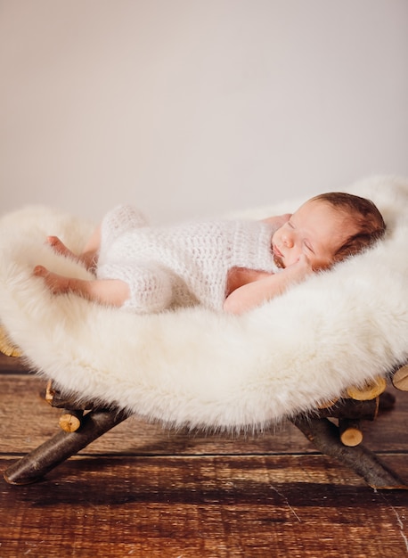 The small baby lies in the basket