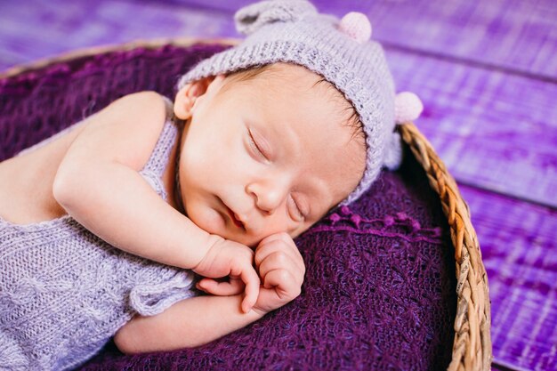 The small baby lies in the basket