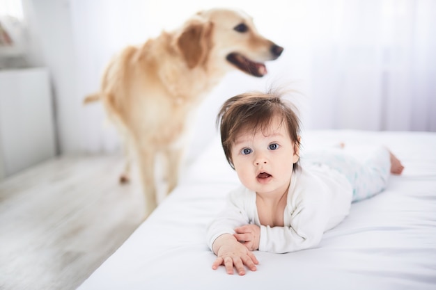 The small baby lies on the bed