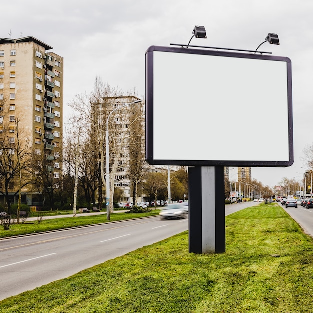 Free photo small billboard on road in city