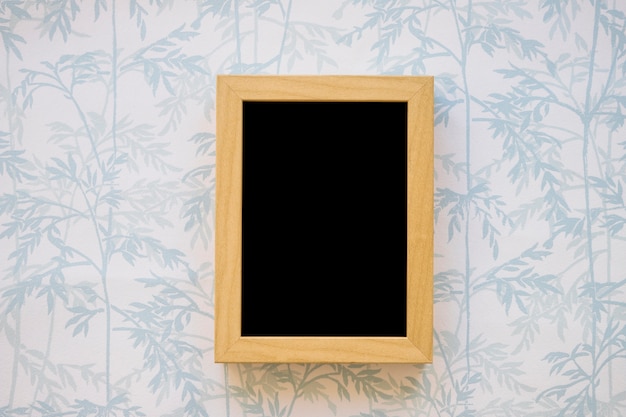 Small blackboard on wallpaper