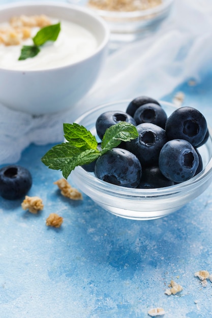 Small blueberries in transparent bowl