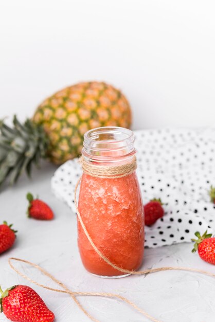 Small bottle with strawberry smoothie