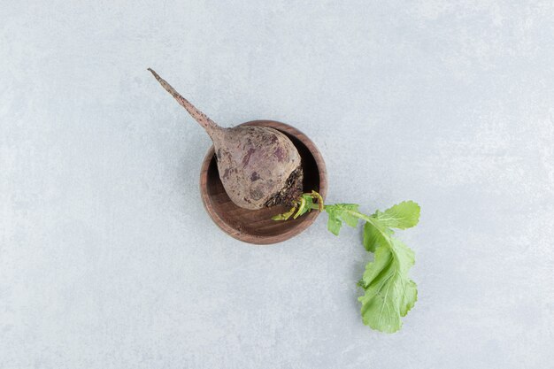 A small bowl of radish , on the marble background.