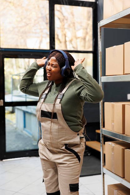 Free photo small business employee dancing during work break