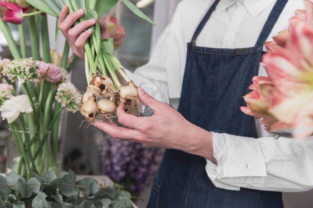 Small business. Male florist in flower shop.