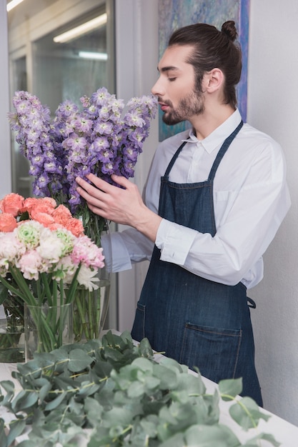 Small business. Male florist in flower shop.