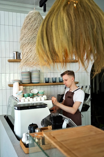 Small business owner cleaning up coffee shop