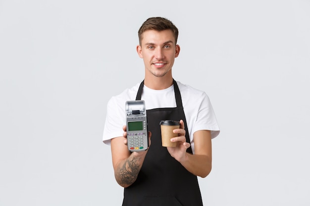 Small business owners coffee shop and staff concept handsome smiling barista waiter serving takeaway...
