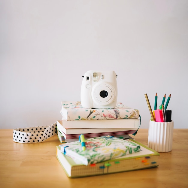 Free photo small camera and stationery