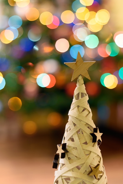 Free photo small christmas tree with bokeh lights