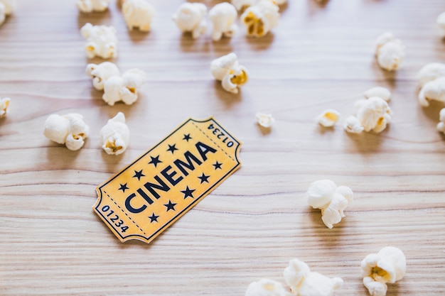 Small cinema ticket with popcorn