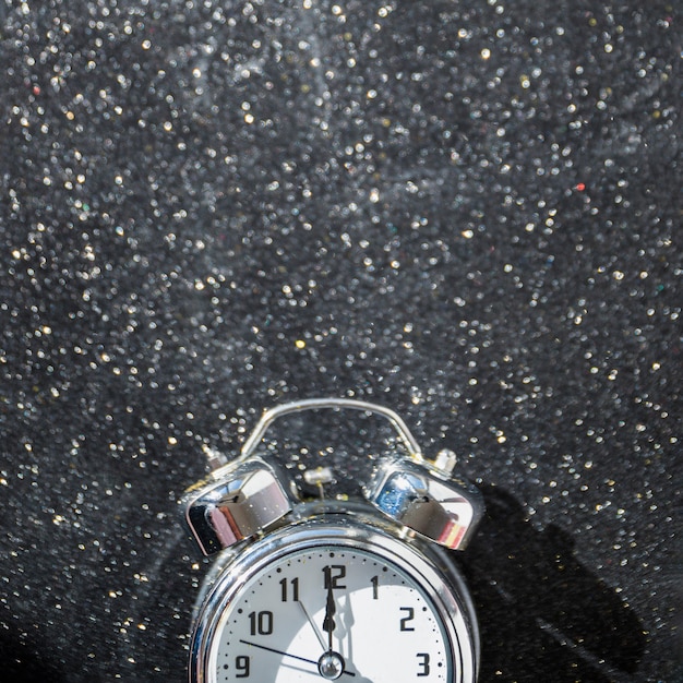 Small clock on shiny table