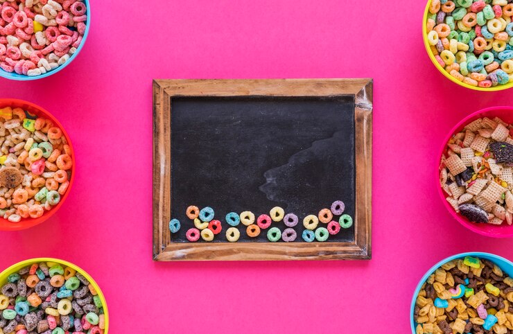 Free Photo small colourful cereals on chalkboard