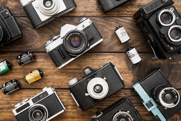 Small film cartridges amidst cameras