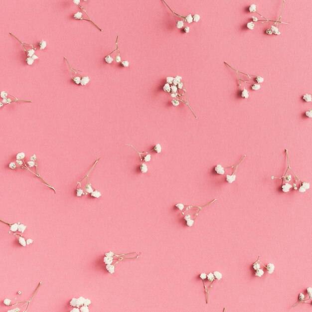 Small flower branches scattered on table