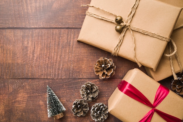 Small gift boxes with cones and small fir tree 