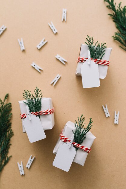 Small gift boxes with cypress branches 