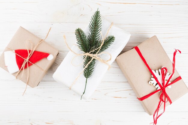 Small gift boxes with ribbons on table