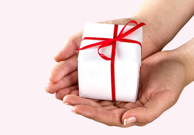 Premium Photo Small gift in the hands of a woman Premium Photo Small gift in the hands of a woman