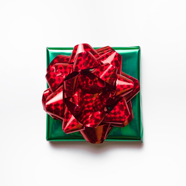 Small green gift box with bow