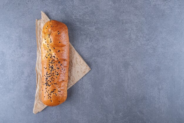 Small lavash and bread on marble table.