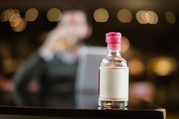 Small liquor bottle on table