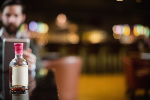 Small liquor bottle on table