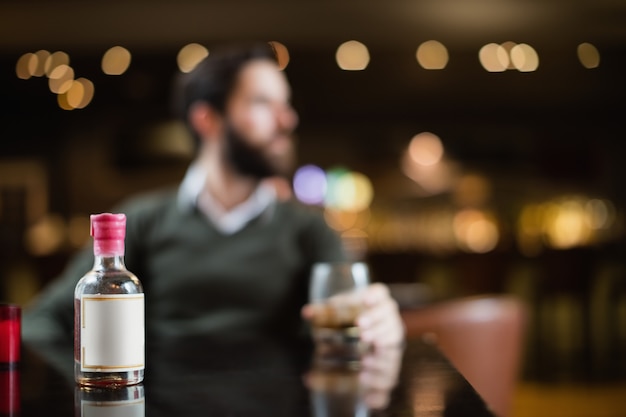 Small liquor bottle on table