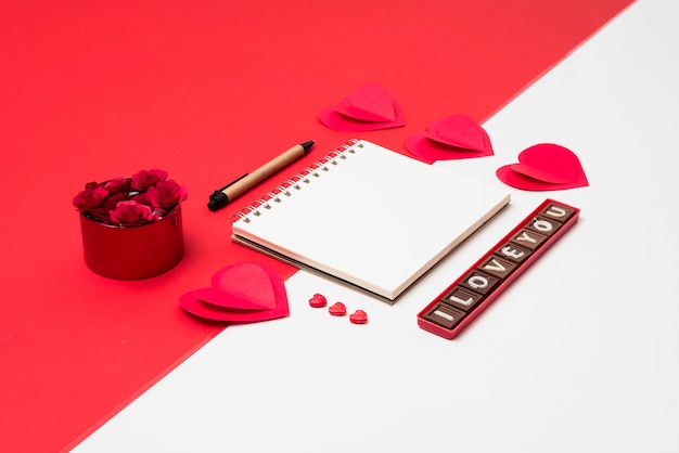 Small notepad with I love you inscription on table