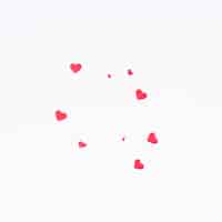 Free photo small paper hearts scattered on table