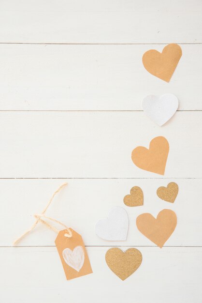 Small paper hearts scattered on table