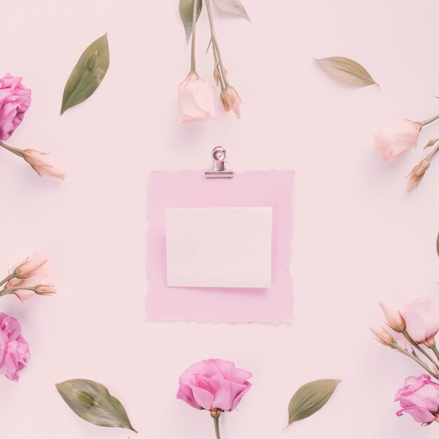 Small paper with rose flowers on table