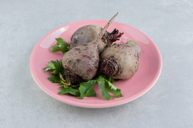 A small portion radishes , on the marble background.