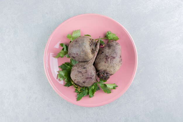 A small portion radishes , on the marble background.