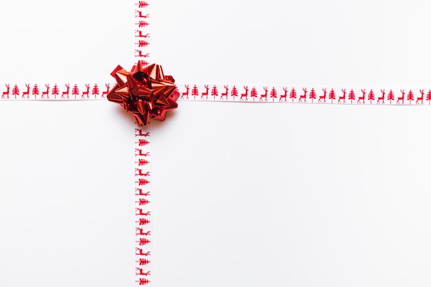 Small red bow with ribbons 