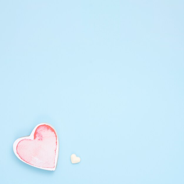 Small red heart on blue table