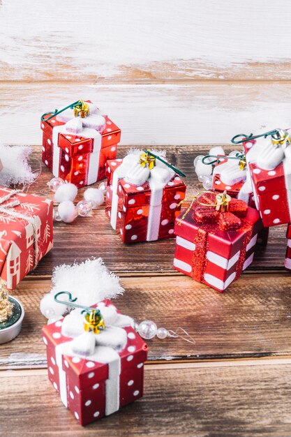 Small red toy gift boxes on table