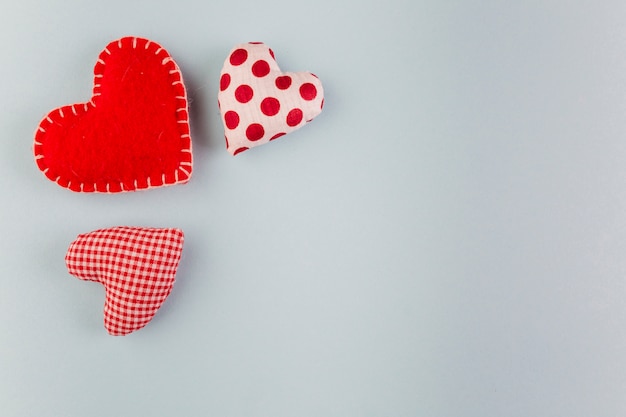 Small soft bright hearts on table