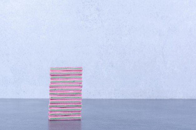 A small stack of chewing gums on marble surface
