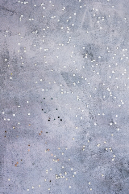 Small star spangles scattered on table