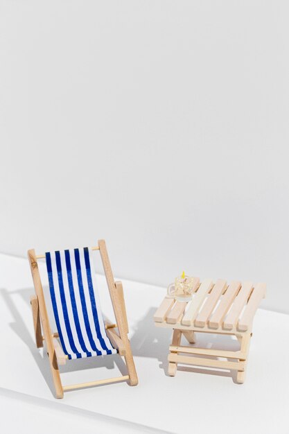 Small sunbed next to wooden table