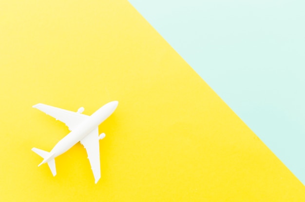 Small toy plane on bright table