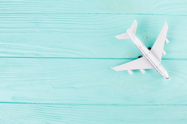 Small toy plane on wood 